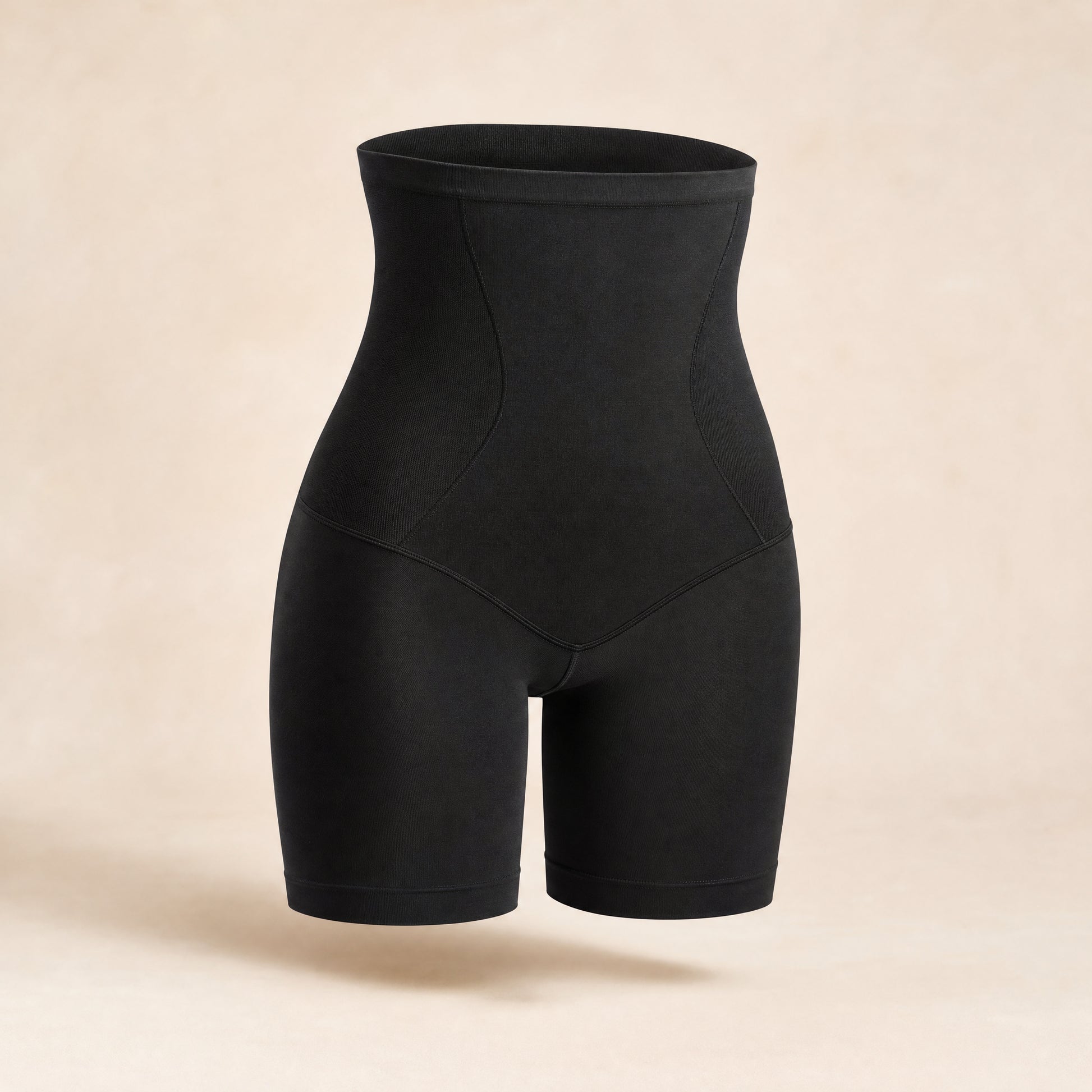 DefineWaist High-Rise Shaping Short in Black, studio photo on cream background